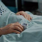 close-up-of-oximeter-on-patient-in-hospital-ward-bed-at-medical-facility-old-man-waiting-on-results-scaled-1.jpg