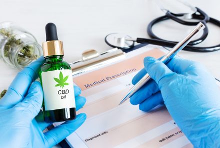 doctor-prescribing-cbd-oil-for-patient-bottle-of-cbd-oil-cannabis-seeds-and-dry-leaves-scaled-1.jpg